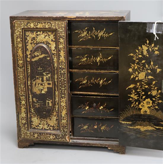 A Chinese black-lacquered and gilt-decorated table cabinet